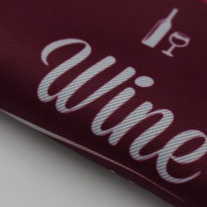 red oversized fabric banner that says wine in white