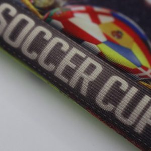 close up view of the 250g soft knitted polyester fabric banner that says soccer cup