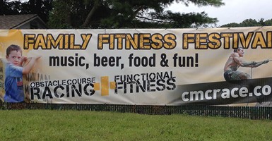 9 oz Heavy Duty Mesh Banner promoting an outdoor festival